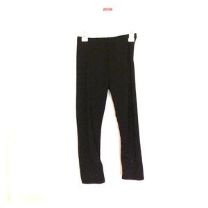 Black pair of pants that are cropped